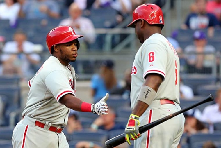 Philadelphia Phillies third baseman Maikel Franco (7) celebrates with first baseman Ryan Howard (6) after hitting a solo home run against the New York Yankees during the first inning at Yankee Stadium. (Brad Penner/USA Today)