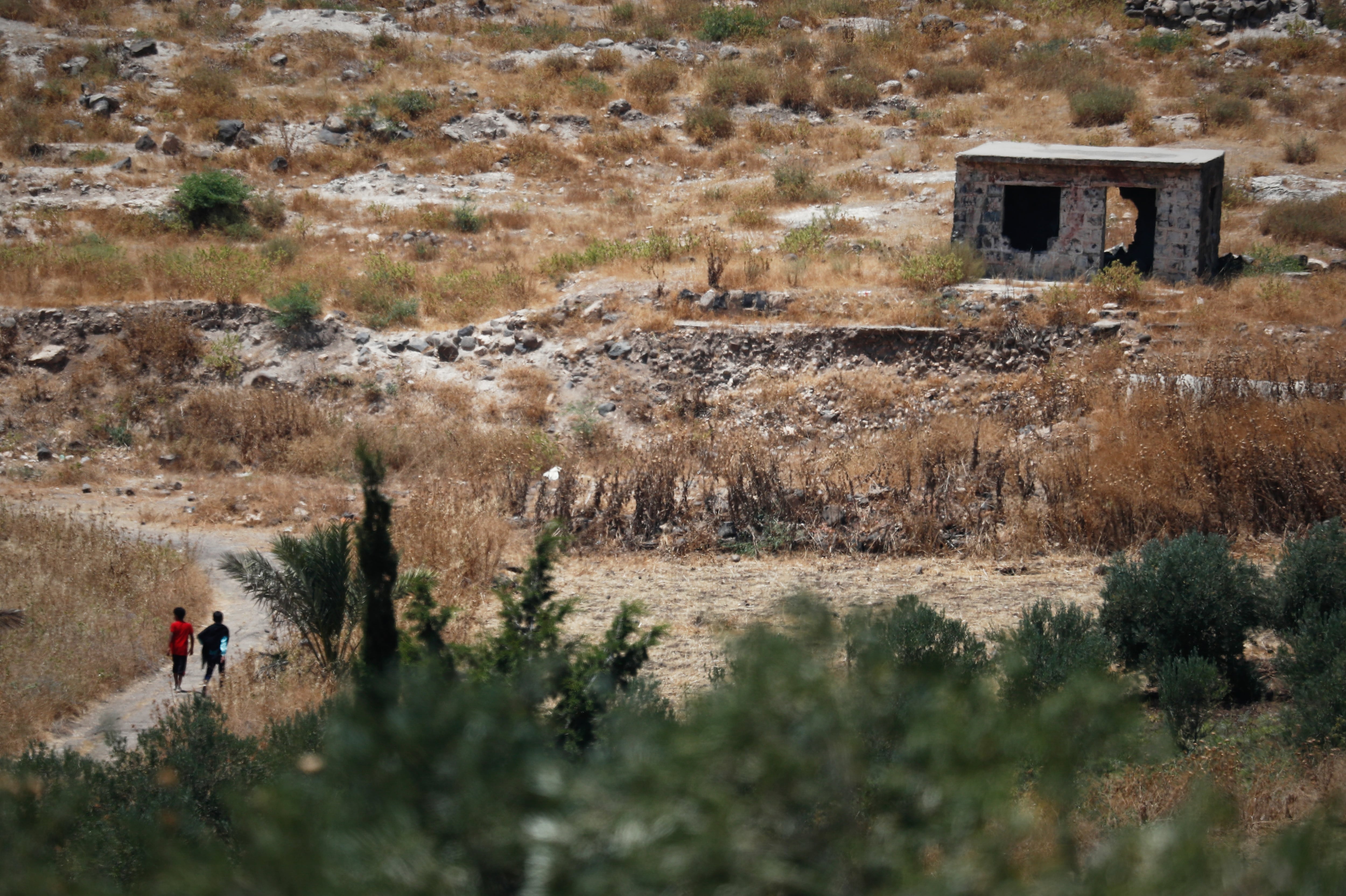 Israeli troops face resistance from residents as they push into a town in Syria