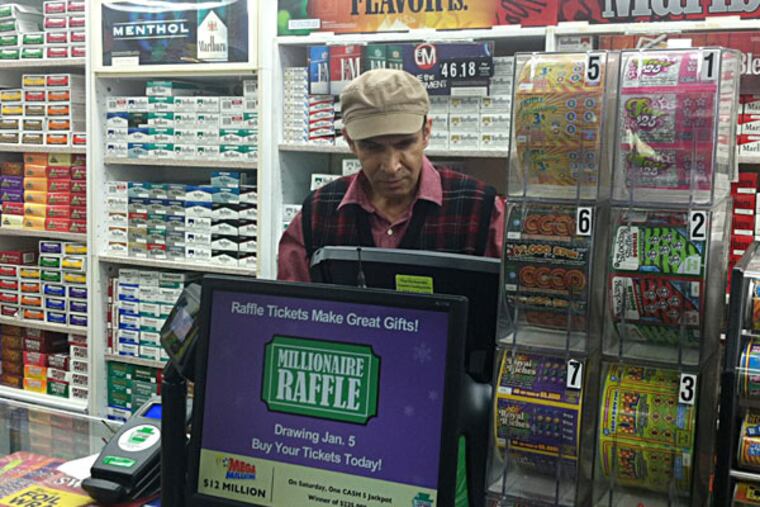 Ashok Kaul of Levittown News & Tobacco has tried to figure out which customer bought the winning ticket. BILL REED / Staff