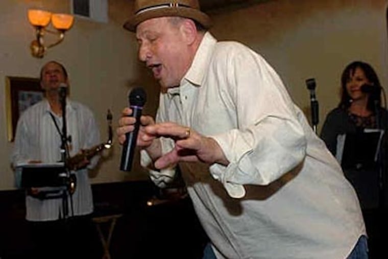 Ralph "Ralphie Head" Abruzzo, granted a one-night reprieve from house arrest, covers Louis Prima tunes in South Philly last night. (Tiffany Yoon / Staff Photographer)