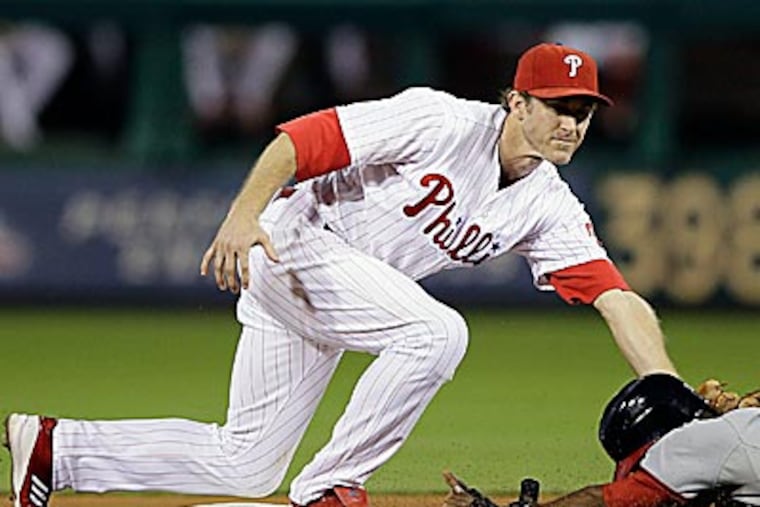 Phillies second baseman Chase Utley will refrain from spending much time reflecting upon what transpired in 2012. (Matt Slocum/AP)