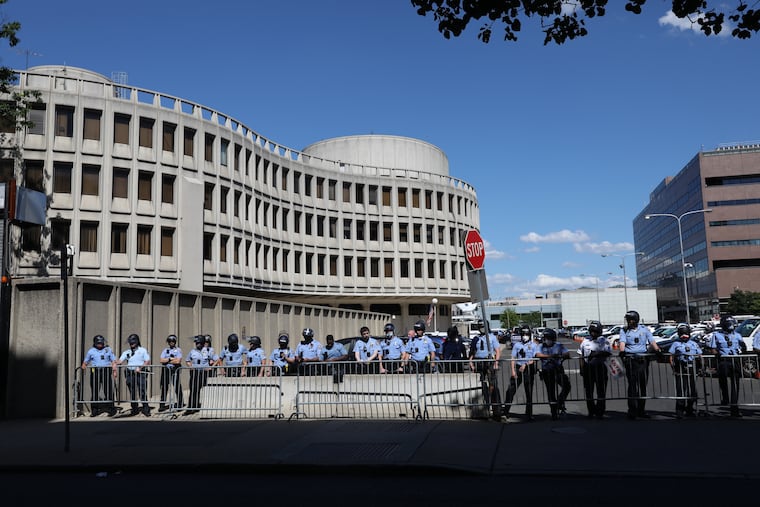 Police guard the Roundhouse amid protests against the death of George Floyd in May. The 911 dispatchers who work on the second floor told City Council on Thursday that their jobs are becoming increasingly difficult.