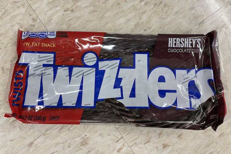 A suit says that Good & Plenty and black Twizzlers contain an ingredient that could be bad for your health.