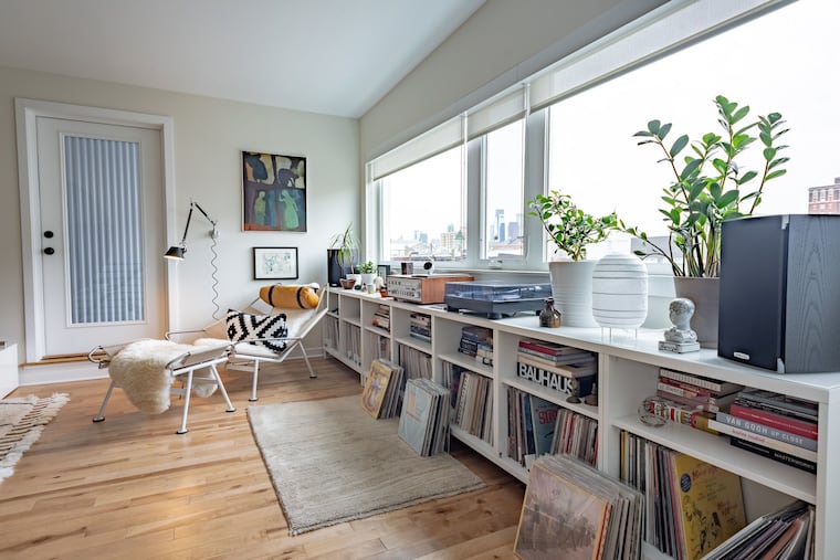 The living room, as well as the bedrooms, dining room, and kitchen, has birch floors.