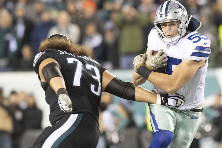 Dallas Cowboys outside linebacker Leighton Vander Esch runs past Eagles offensive guard Isaac Seumalo on a first-Vander Esch quarter-interception on Sunday, November 11, 2018 in Philadelphia. JOSE F. MORENO / Staff Photographer
