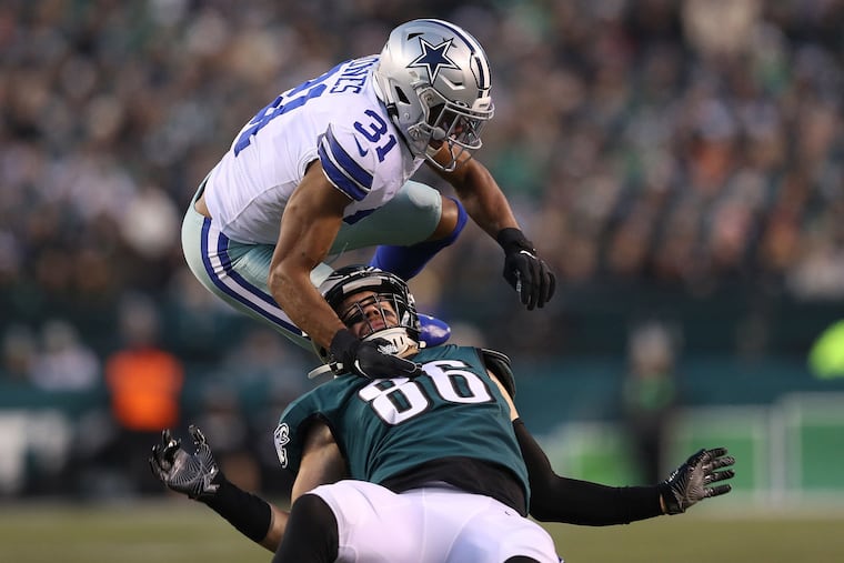 Byron Jones of the Cowboys breaks up a pass intended for Zach Ertz during a game in December.