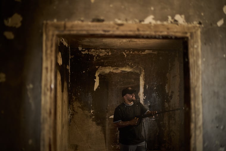 A Palestinian man cleans a room of a house damaged following an attack by Israeli settlers the previous day in the village of Sarra, near the West Bank city of Nablus, Saturday, July 25, 2026.