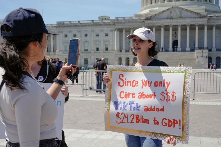 A TikTok content creator, speaks to reporters outside the U.S. Capitol, Tuesday, April 23, 2024, in Washington, as Senators prepare to consider legislation that would force TikTok's China-based parent company to sell the social media platform under the threat of a ban, a contentious move by U.S. lawmakers.