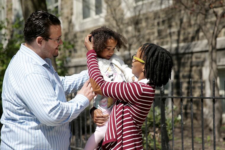 Joseph Andino shares a moment with his wife, Sandra, and daughter, Regina, near their home in Philadelphia, PA on April 15, 2020. Many of Pennsylvania's 1.3 million jobless workers are frustrated with the state's unemployment system. Joseph Andino, 37, a sous chef, filed on March 16, he got an initial notification from the state, and for three weeks, has not heard anything more. He can't get through to Unemployment Office by phone, email, webchat. Now his wife is unemployed, the bills are coming due, and they're trying to keep up a strong front for their 3 year old daughter.