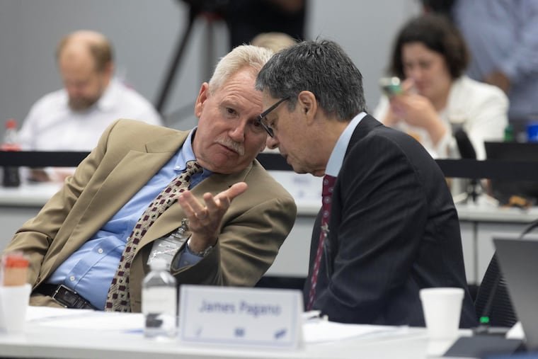 Kirk Milhoan (left), the newly appointed chair of the CDC's Advisory Committee on Immunization Practices, speaks to fellow panelist James Pagano during a Sept. 19 committee meeting at the CDC's Atlanta campus.
