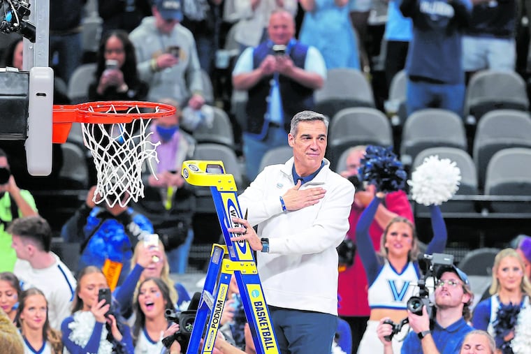 Coach Jay Wright turns towards the Villanova fans with his hand over his heart before taking his turn at cutting the net as Villanova celebrates after winning the South Regional championship game in the NCAA Tournament on March 26, 2022 at AT&T Arena in San Antonio, Texas. They will advance to the Final Four in New Orleans. (CHARLES FOX) (CHARLES FOX)