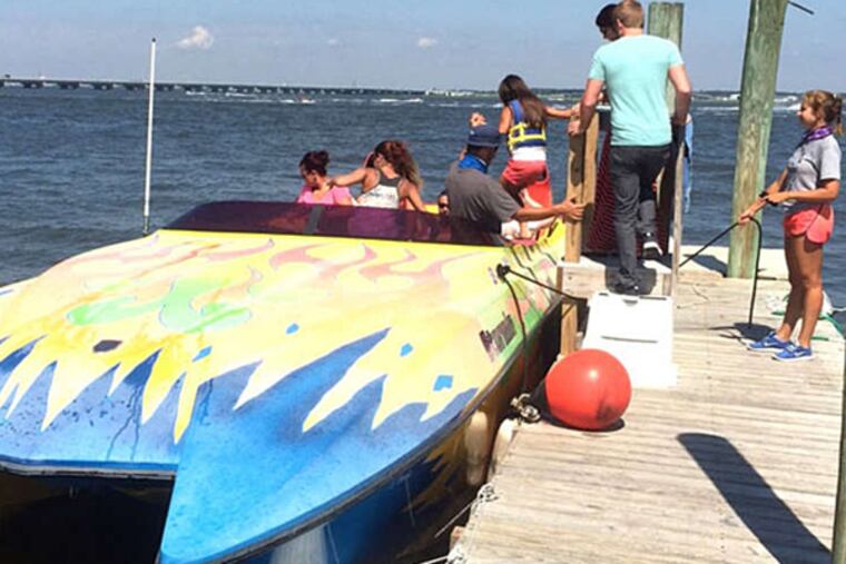 Dolphin-sighting seekers board the Ocean City-based Stormin' for an excursion that's part nature show, part thrill ride. (CHUCK DARROW / DAILY NEWS STAFF)