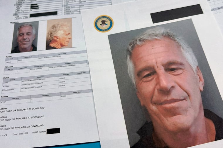 Documents that were included in the Justice Department's release of the Jeffrey Epstein files are photographed on Friday, Jan. 2, 2026.