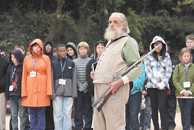 John Brown, in the person of Steven Hanson, delivers a history lesson to visitors at Harpers Ferry National Historical Park. (Michael Bryant / Staff Photographer)