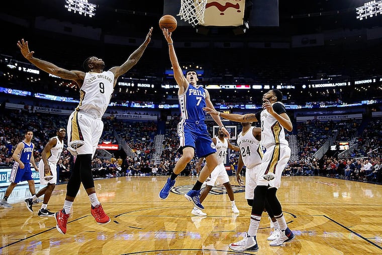 Philadelphia 76ers forward Ersan Ilyasova (7) goes to the basket between New Orleans Pelicans forward Terrence Jones (9), , forward Solomon Hill (44), guard Buddy Hield (24) and forward Anthony Davis (23) in the second half of an NBA basketball game in New Orleans, Thursday, Dec. 8, 2016. The 76ers won 99-88.
