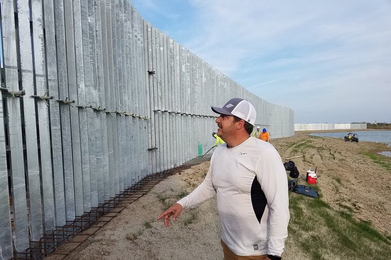 Tommy Fisher, president and CEO of Tempe, Ariz.-based Fisher Industries, surveyed border fencing that he's building on private land in south Texas.