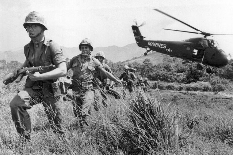 U.S. Marines stream into a suspected Viet Cong village near Da Nang, Vietnam, on April 28, 1965.