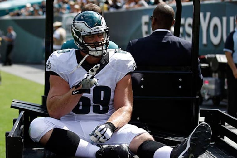 Evan Mathis gets carted off the field during the second quarter against the Jacksonville Jaguars. (Yong Kim/Staff Photographer)
