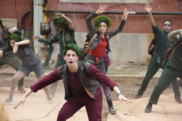 Milo Manheim (foreground) stars as a zombie named Zed who longs to play football in the Disney Channel movie “Zombies,” co-written by Cheltenham native David Light