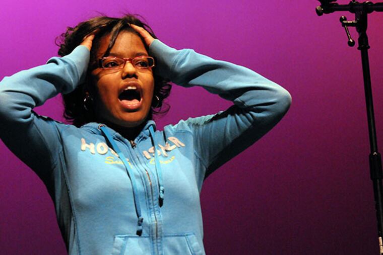 Kamaya Jackson, 16, from Woodrow Wilson High School, presents a poem at the Youth for Truth Spoken Word Event at Rutgers Camden. Camden kids presented poems and compete for prizes. ( APRIL SAUL / Staff )