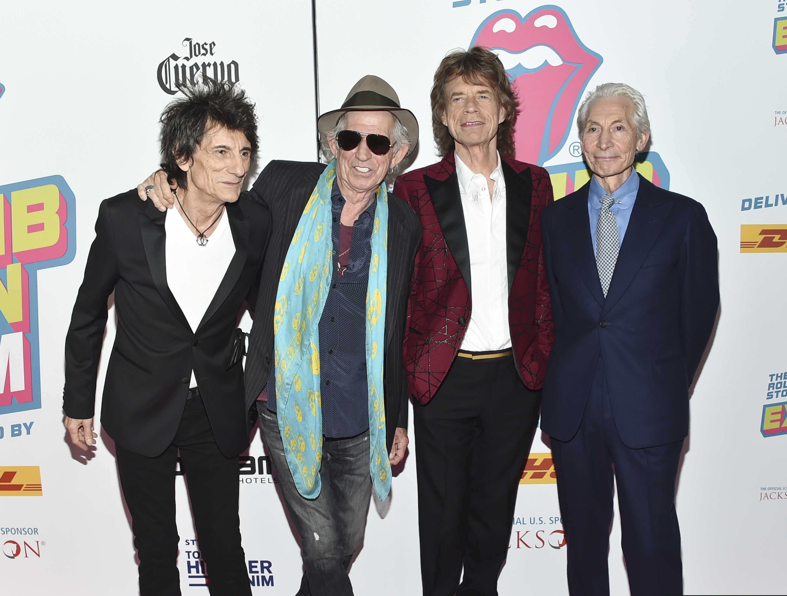In this Nov. 15, 2016, file photo, the Rolling Stones -- from left, Ronnie Wood, Keith Richards, Mick Jagger, and Charlie Watts -- attend the opening night party for "Exhibitionism" at Industria in New York. The New Orleans Jazz and Heritage Festival has got satisfaction: The Rolling Stones are among headliners for the 50th anniversary festival. Organizers Tuesday, Jan. 15, 2019, confirmed reports that Mick Jagger and his band will play. (Photo by Evan Agostini/Invision/AP, File)