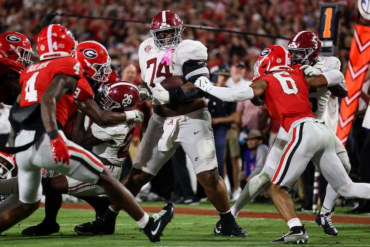Alabama offensive lineman Kadyn Proctor (74) runs with the football during the first half against Georgia on Sept. 27.