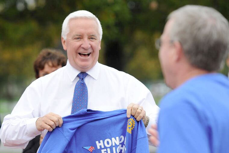 Gov. Corbett with a veterans' group. He says he made tough choices that were not popular but were right.