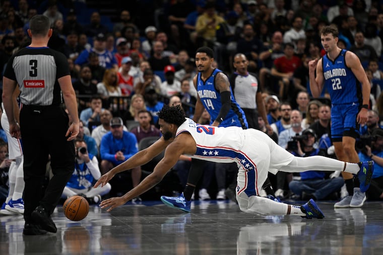 Joel Embiid dives after a loose ball against the Orlando Magic on Friday. He believes the Sixers can get out of their funk once they get healthy.