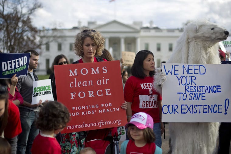 Demonstrators gather in front of the White House during a rally Friday against President Trump's Energy Independence Executive order. Environmental groups are looking to mobilize a public backlash against the elimination of many restrictions of fossil fuel production.