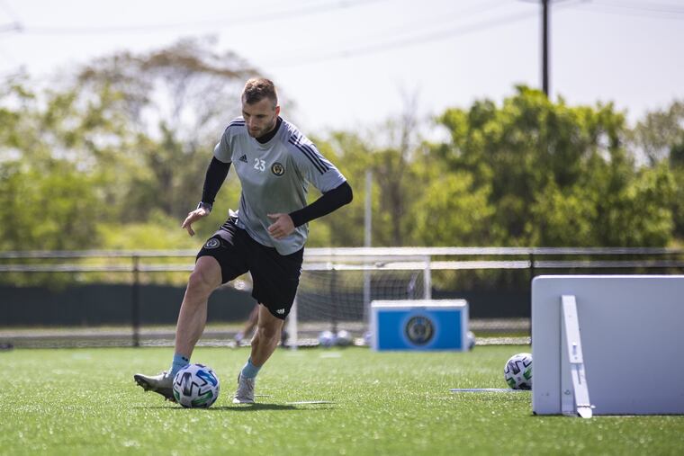 Union forward Kacper Przybylko dribbles a ball during an individual workout at the 76ers' fieldhouse in Wilmington, Delaware earlier this month.