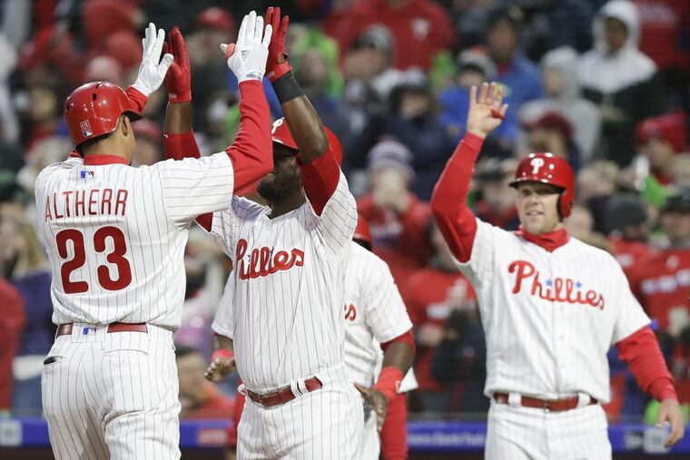 Phillies Aaron Altherr celebrates his third-inning grand slam home run with teammate Odubel Herrera against the Miami Marlins on Saturday, April 7, 2018 Philadelphia.