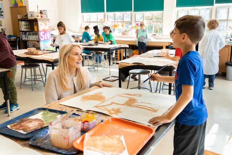 Karen Warren Coleman, who was named head of school at William Penn Charter School, in class with a student during her visit last week to campus.