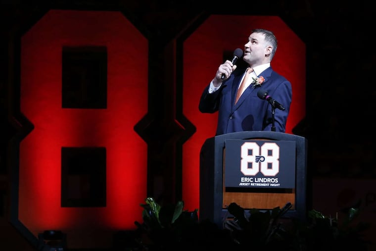 Former Flyer center Eric Lindros speaks to fans before his No. 88 was retired on Thursday.