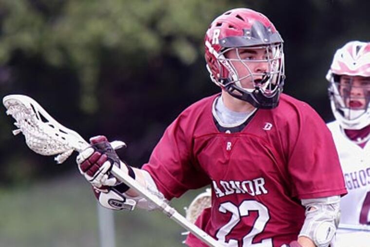 Radnor’s Mike Barnes looks toward the goal after eluding Abington’s Matt Lomady. (Lou Rabito / Staff)