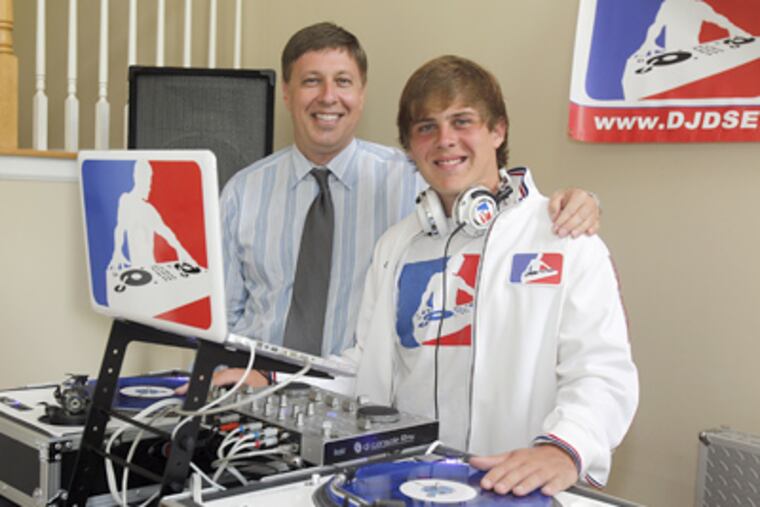 Daryle (left) and Darien Seidman at their Medford home with their digital vinyl technology. (AKIRA SUWA / Staff Photographer)