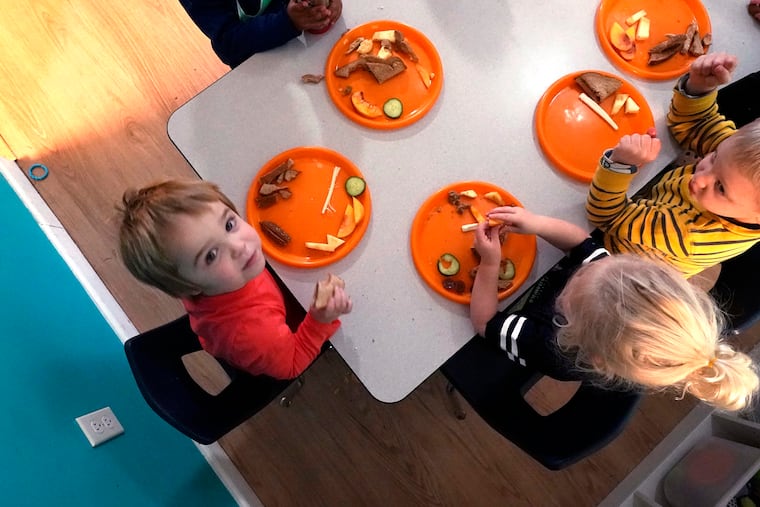Preschool children eat lunch at a day care facility, in Mountlake Terrace, Wash., in 2021. Parents face lots of decisions when it's time to pack their kids' lunches. (AP Photo/Elaine Thompson)