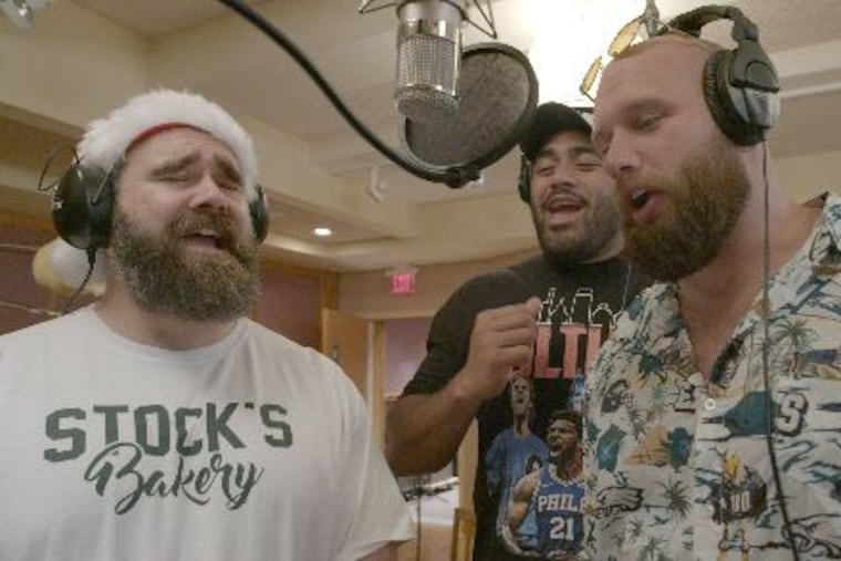 Eagles linemen Jason Kelce (from left), Jordan Mailata, and Lane Johnson are back with another holiday album. The album will benefit CHOP and CCTC.