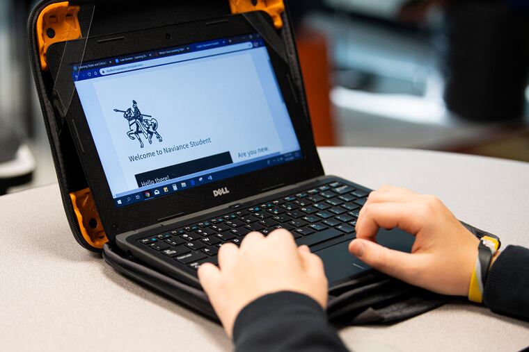A seventh-grade student types on his personal computer during a cyber class at Peirce Middle School in West Chester.