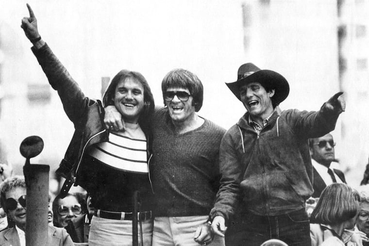 Larry Bowa, right, joined Tug McGraw and Pete Rose in saluting the fans during the Phillies' World Series victory parade on Oct. 22, 1980.