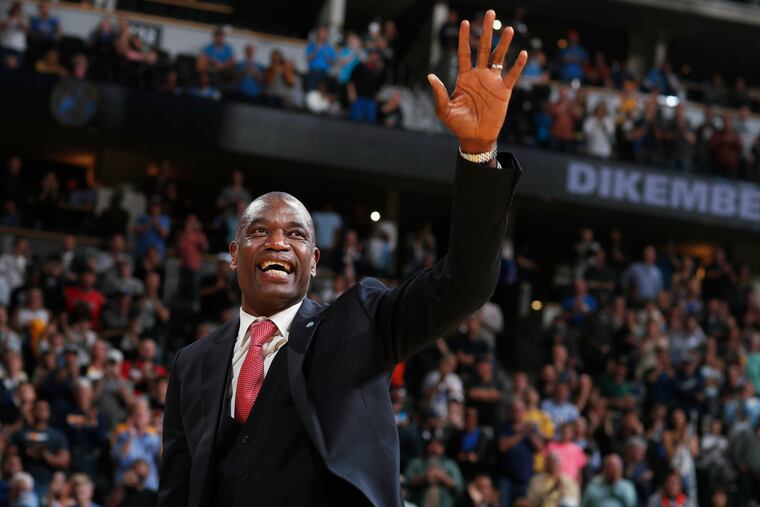 Dikembe Mutombo waves to the crowd as his jersey number is retired by the Denver Nuggets on Oct. 29, 2016.