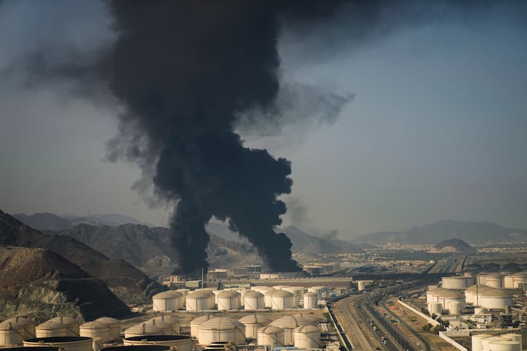 Plumes of smoke rise from an oil facility in Fujairah, United Arab Emirates, Saturday, March 14, 2026.