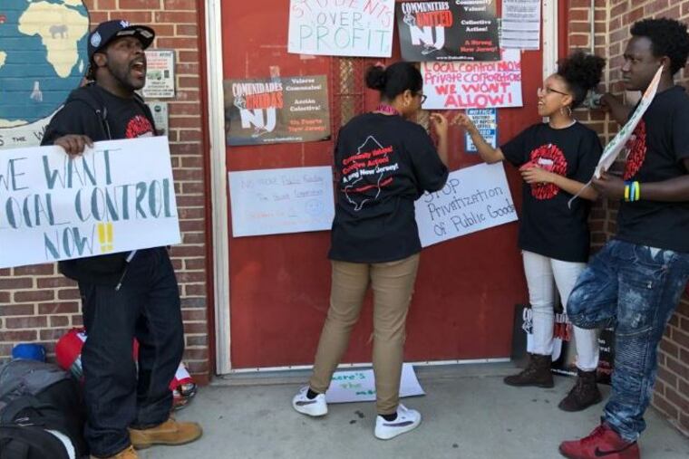 A group of protesters are demonstrating in front of the administrative offices for the Camden school district. They want more funding for traditional public schools and local control.