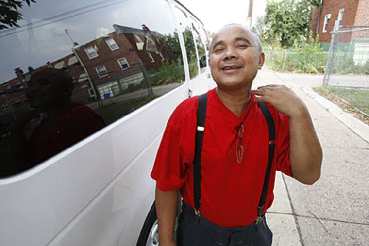 Hak Ouk, 58, makes a throat-cutting gesture as he describes his fate if he returns to the village he left in the 1970s. As a Cambodian soldier, Hak fought alongside U.S. troops in Vietnam. But after firing a gun during a 2000 fight at a Philadelphia Parking Authority lot, he served five months of house arrest.