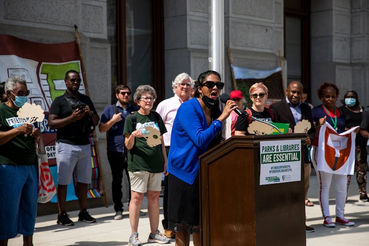 Sunita Balija, a children’s librarian, speaks to press during a rally with fellow labor leaders and advocates from parks and libraries who are demanding a larger investment in the next budget cycle.