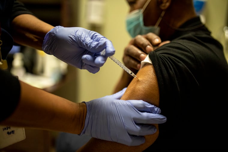 Vincent Rochester, 85, Voorhees N.J., receives the COVID-19 vaccine at the Philadelphia VA Medical Center on Saturday, Jan. 23, 2021. “Don’t be nervous, do what is necessary and get your shot,” Rochester said.