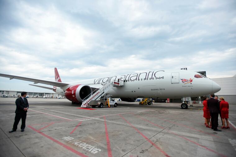 FILE - This June 11, 2015, file photo shows Virgin Atlantic's Boeing 787-9 at Detroit Metropolitan Airport in Romulus, Mich. Britain's Virgin Atlantic has dropped a requirement that female flight attendants wear makeup, joining other major carriers that have eased their dress and grooming requirements after complaints about turning female employees into sex objects. (Tanya Moutzalias / Flint Journal via AP, File)