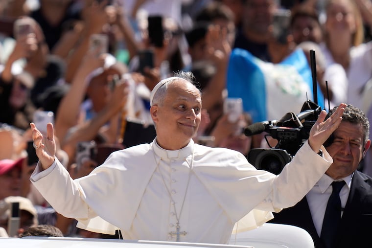 Pope Leo XIV gestures as he arrives for his weekly general audience in St. Peter's Square at The Vatican, Wednesday, June 4, 2025. (AP Photo/Gregorio Borgia, File)