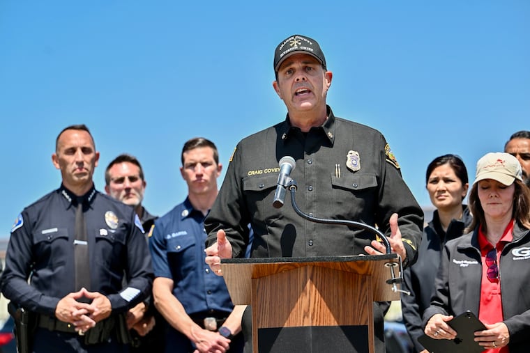 Orange County Fire Authority Division Chief Craig Covey speaks during a news conference at the Los Alamitos racetrack in Cypress, Calif., Friday, May 22, 2026, about hazmat situation in Garden Grove, Calif.
