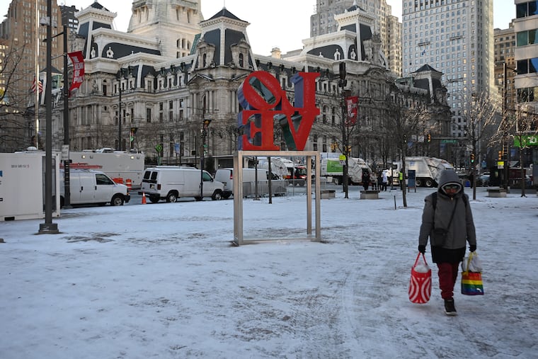 An early morning snow squall left a dusting in LOVE Park before the start of the Mummers Parade near City Hall Thursday, Jan. 1, 2026. This year marks the 125th anniversary of Philly’s iconic New Year’s Day celebration.