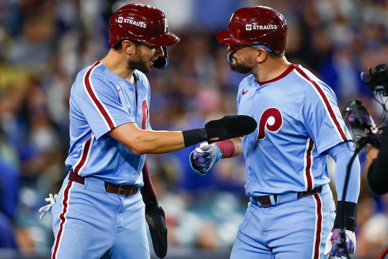 The Phillies' Kyle Schwarber celebrates his two-run home run with Trea Turner during the eighth inning of Game 3 on Wednesday.